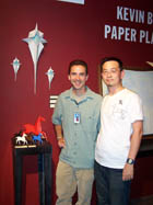 Kevin Box and Kyle Fu stand next to their famous origami horse bronze sculpture