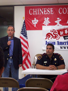 Bill Calderon of the Sharpstown Management District speaks to the residents and business owners at the Town Hall Meeting